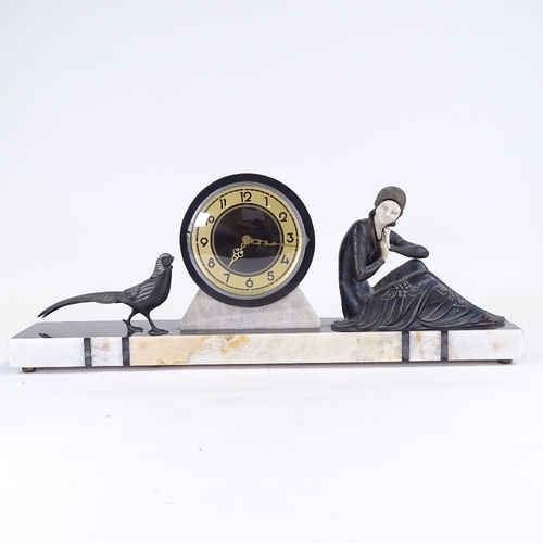 81 - An Art Deco 2-colour marble mantel clock, surmounted by spelter woman and pheasant, replacement batt... 