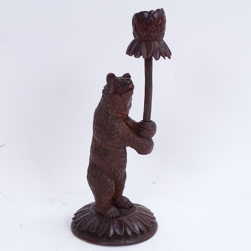 4 - A 19th century carved wood Black Forest bear design candlestick, height 26cm