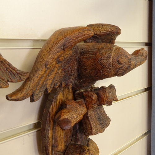 118 - An opposing pair of carved pine eagle wall brackets, height 33cm