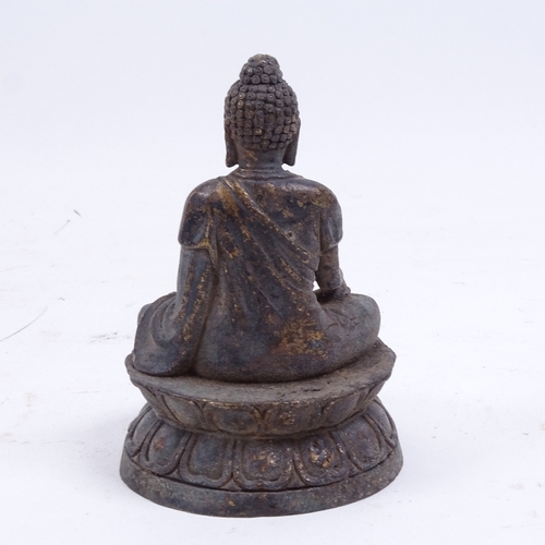 132 - A small Chinese bronze seated Buddha, on double-lotus base, height 11cm