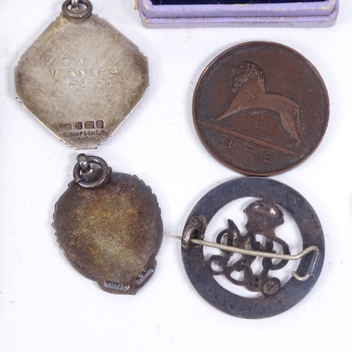 135 - Various early 20th century medals and badges, including some silver and the Welch Regiment