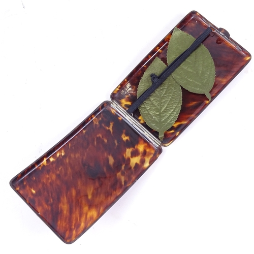 145 - A Vintage curved tortoiseshell cigarette case, with unmarked silver mount, length 13cm