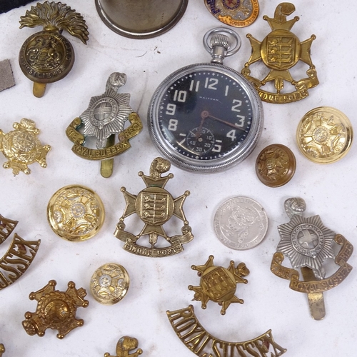 159 - Various militaria collectables, including military issue Waltham pocket watch, Royal Sussex cap badg... 