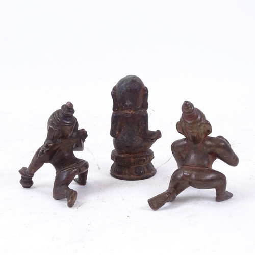 203 - An Indian patinated bronze figure of Ganesh, height 8cm, and 2 bronze kneeling Buddha figures (3)