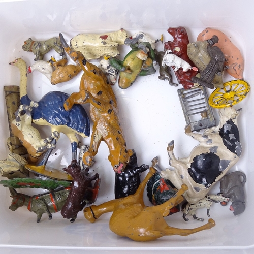 215 - A collection of Vintage diecast metal farm animals, cart and building etc