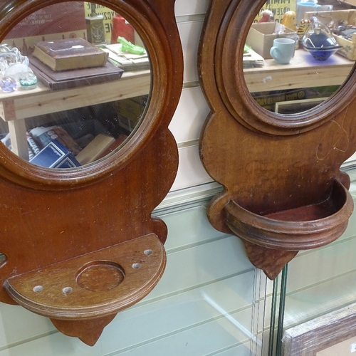 224 - A pair of mahogany wall brackets with inset mirrors, height 70cm