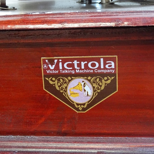 287 - A reproduction Victrola twin brass-horn gramophone, base width 45cm