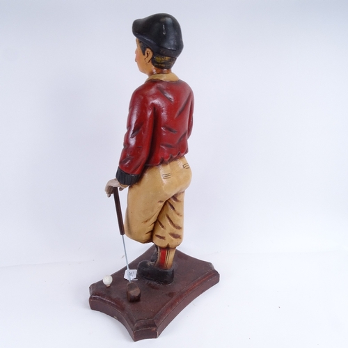 297 - A carved and painted wooden figure of an Edwardian golfer, 67cm