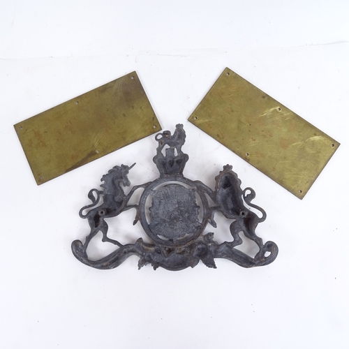 398 - A cast-brass Royal coat of arms, length 29cm, and 2 brass County Borough of Hastings plaques