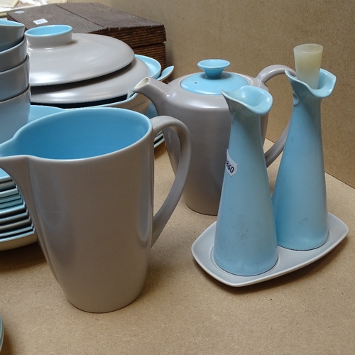 413 - 1960s Poole Pottery Twintone dinnerware and matching teaware, including a teapot and hot water jug