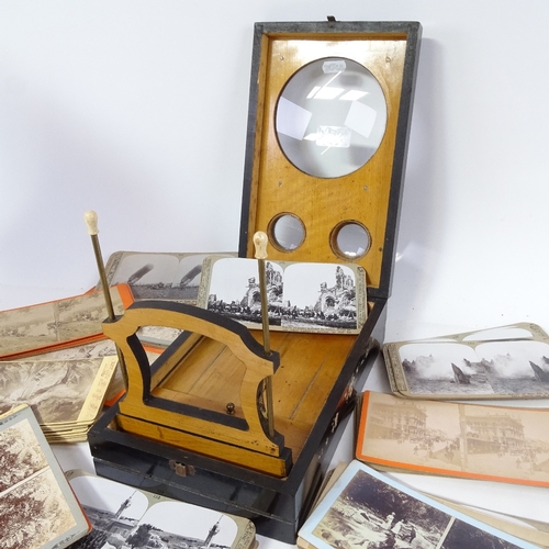 427 - A lacquered stereoscopic Edwardian viewer, and a selection of slides, including First World War and ... 