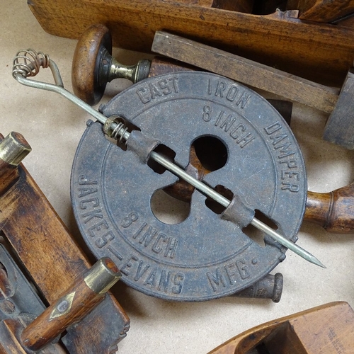 442 - Working planes, a cast-iron damper, and a brass-mounted mahogany spirit level, 65cm