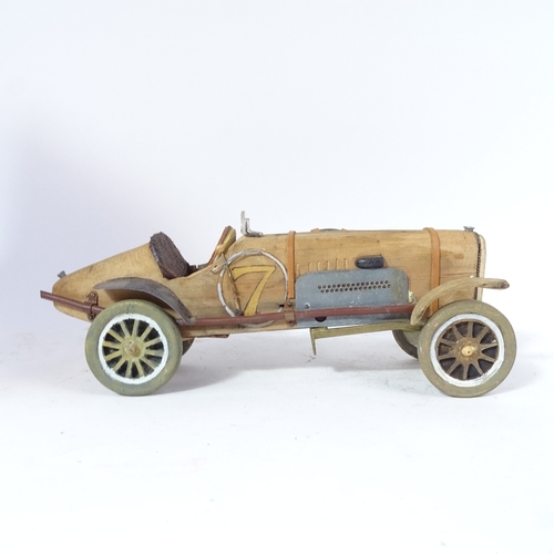 450 - A replica hand-built wood and steel model of a Veteran sports car, length 38cm