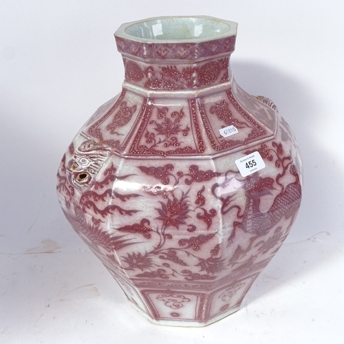 455 - An octagonal Chinese vase, with mask handles and  mythical beast decoration, height 37.5cm