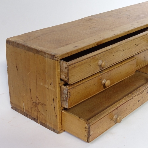 458 - An Antique pine collector's chest of 7 drawers, with turned wood handles, length 56cm