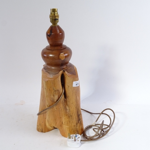 476 - A carved wood table lamp, 48cm overall