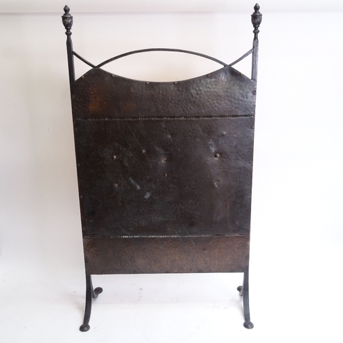 48 - A Victorian Aesthetic Movement wrought-iron framed copper fire screen, brass figural swag mounts wit... 