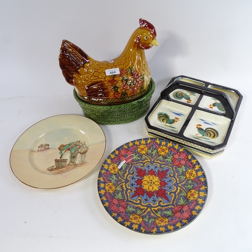 484 - A large pottery chicken figure egg container, a quimper hors d'oeuvres dish with cockerel decoration... 