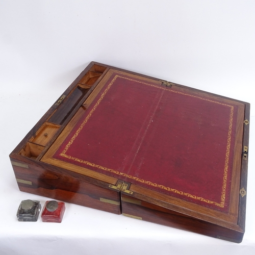 56 - A large 19th century brass-bound rosewood folding writing slope, red leather slope with secret compa... 