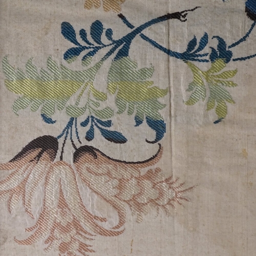 560 - An 18/19th century silk panel from part of a wedding dress, in stained wood frame, 97cm x 45cm