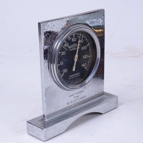 569 - An aneroid wall barometer in carved oak frame, and an Art Deco thermometer in chrome plate frame (2)