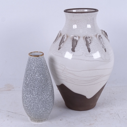 570 - A Studio white crackle glaze vase, indistinct signature, height 25cm, and a smaller crackle glaze va... 