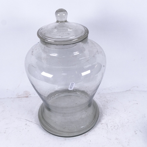 576 - A large hand-blown Victorian glass jar and cover, height 37cm