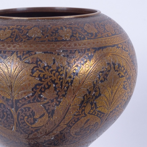 590 - An Islamic engraved and enamelled brass bowl on pedestal, early 20th century, height 24cm