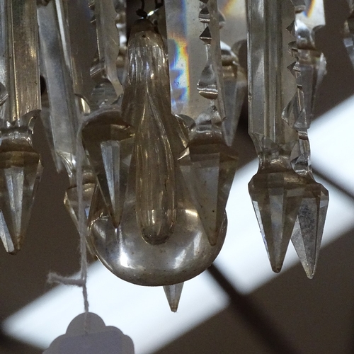 597 - A large brass-framed 3-tier hanging light fitting, with tears of baguette-cut arrowhead glass lustre... 