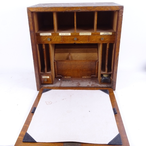 599 - A panelled oak stationery cabinet, circa 1900, width 38cm