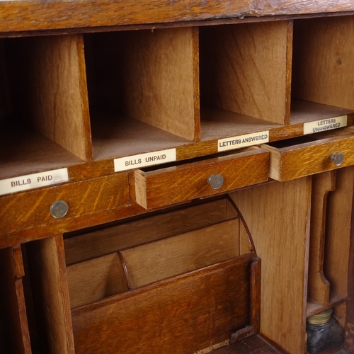 599 - A panelled oak stationery cabinet, circa 1900, width 38cm