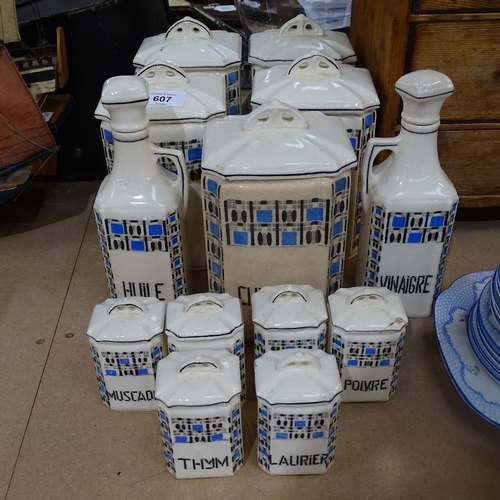 607 - A set of 1930s French ceramic kitchen storage jars, and matching oil and vinegar bottles, height 22.... 