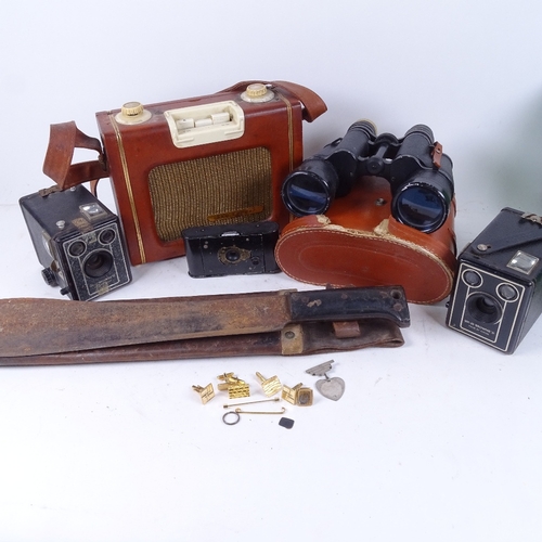 648 - Cameras, Regent 7x50 binoculars, cufflinks, 1943 Montreal leather-cased machete, and a Skyleader por... 