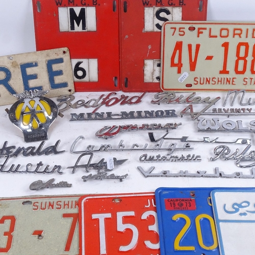 658 - Vintage American metal car number plates, chrome plated car model badges, an AA badge etc