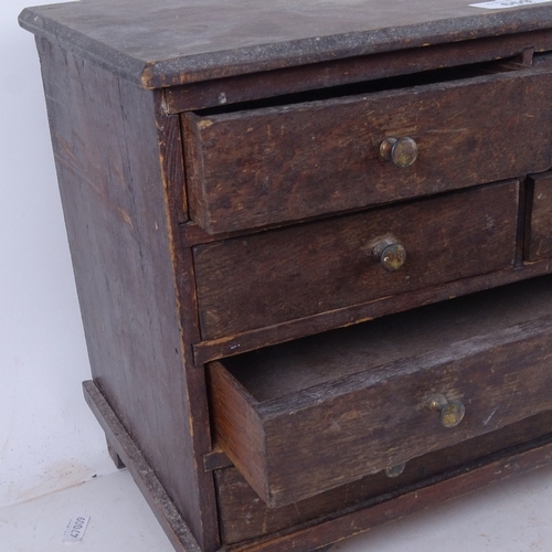 659 - A table-top Antique oak collector's chest of 4 short and 2 long drawers, 38cm across