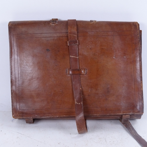 660 - An Egyptian Army leather case, with sectioned and pocket fitted interior, 43cm across