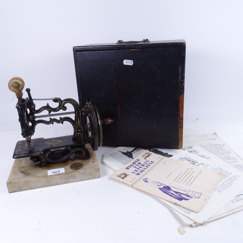 664 - An Antique Newton & Wilson sewing machine in original wooden box, height 24cm, and a quantity of Byg... 