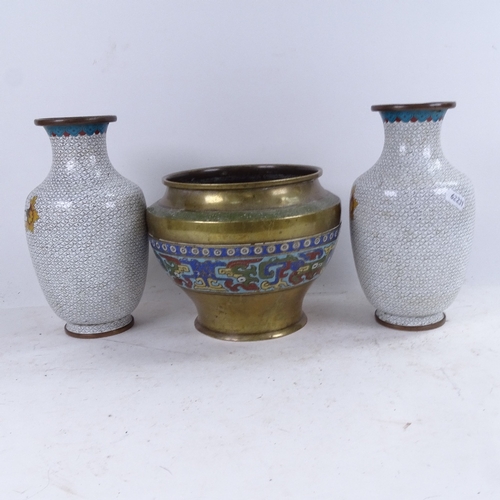 668 - A pair of cloisonne vases with floral spray decoration, 23cm, and a brass pot with enamelled frieze