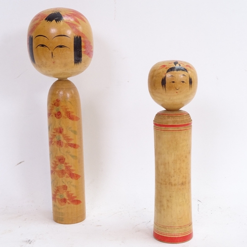 76 - 2 Oriental turned and stained wood Kokeshi dolls, largest height 24cm (2)