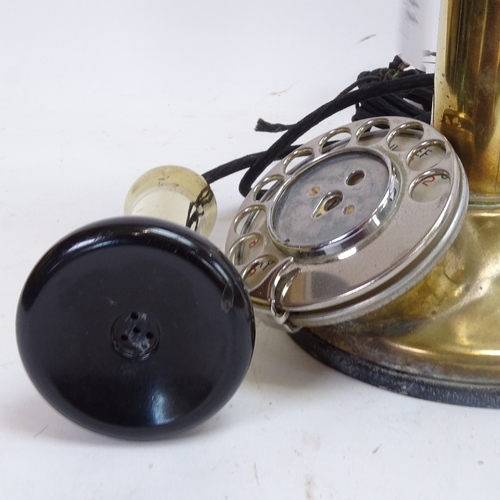 77 - A Vintage brass candlestick dial telephone, height 31cm