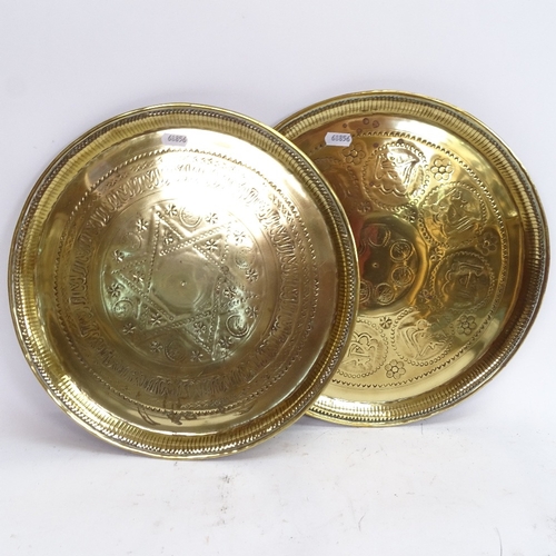 78 - An Islamic enamelled copper tray, and 2 Islamic brass trays, largest diameter 34cm (3)