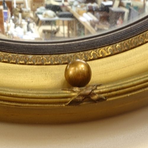 82 - An early 20th century gilt-gesso circular convex wall mirror, overall diameter 40cm