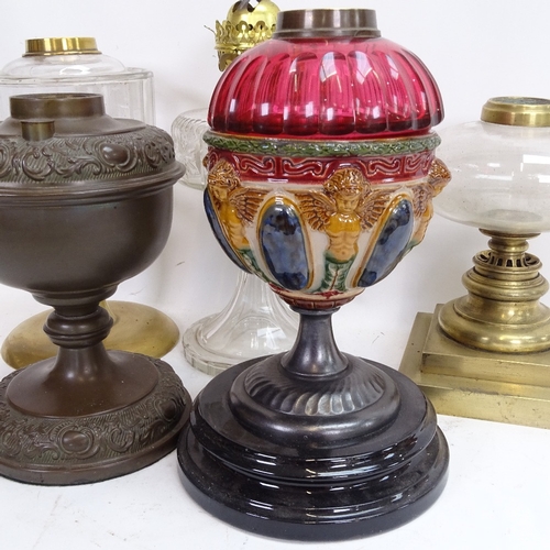 84 - A large collection of various oil lamp parts and spares, including shades, bases and chimneys (3 box... 