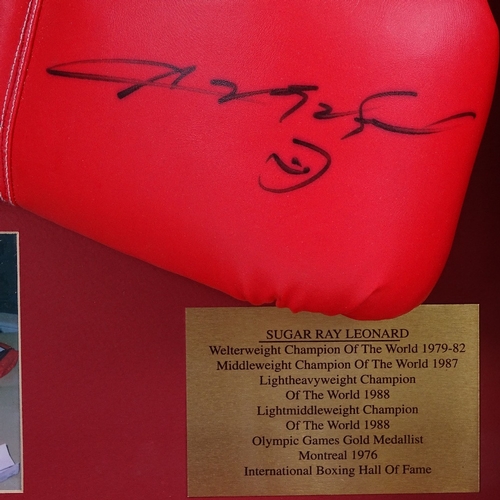 683 - A framed boxing glove signed by Sugar Ray Leonard