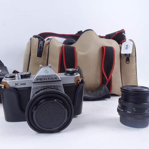 684 - A Pentax K1000 camera, a Vivitar lens, and accessories in case