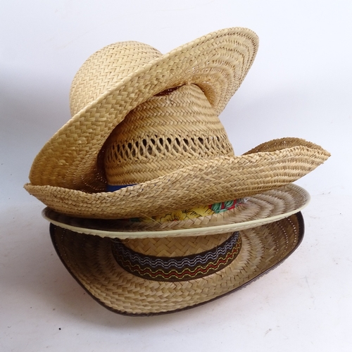 722 - A wicker basket containing various straw hats