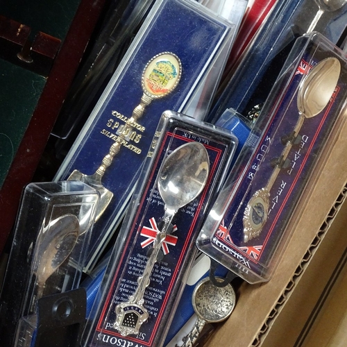 733 - A box of plated souvenir spoons, and 2 boxed display cases