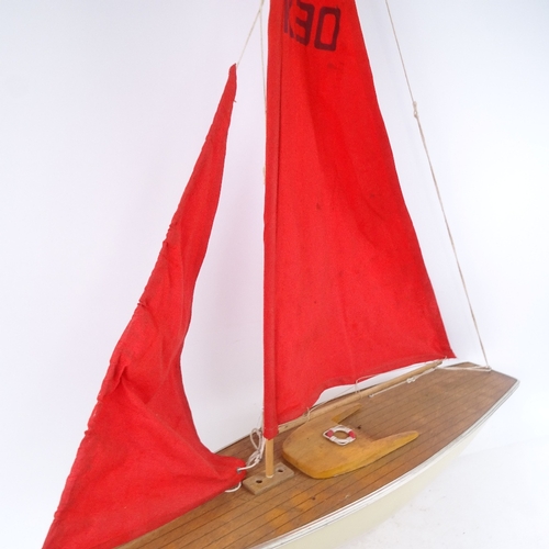 744 - A model pond yacht with sails, length 75cm