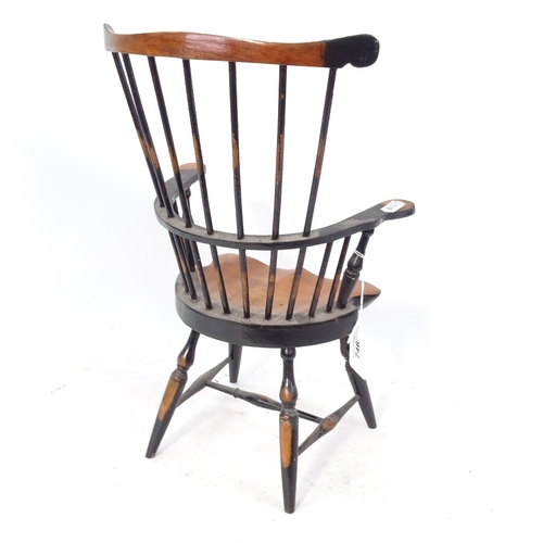 746 - A painted wood Windsor style doll's armchair with spindle back, 38.5cm