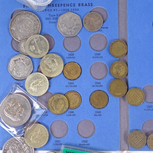 794 - A collection of coins, including brass trupences, first decimal coins, various £5 and £2 coins etc